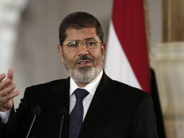 عاجل.. وصول الرئيس مرسي إلى مقر المحاكمة بأكاديمية الشرطة