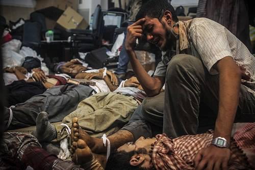 ارتفاع ضحايا مذبحة رابعة إلي 77