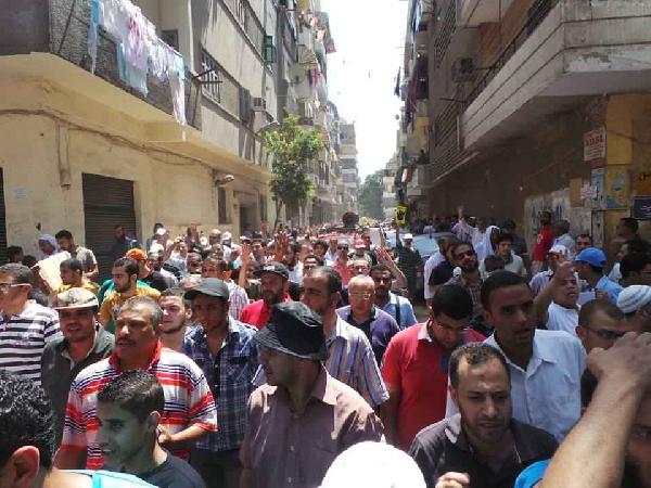 مسيرة بحي الزيتون تندد بمجازر الانقلاب