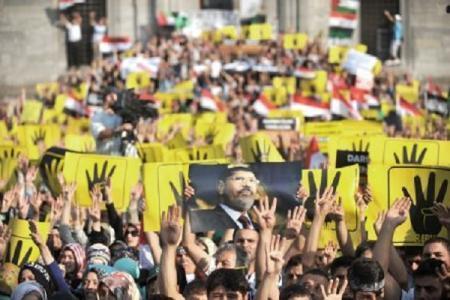 عدوى الانقلاب بالأردن توقف3 نشطاء لحيازة ملصقات”شعار رابعة”