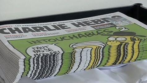 “شارل أيبدو” تتعهد بالسخرية من الرسول (ص) بـ 12 لغة