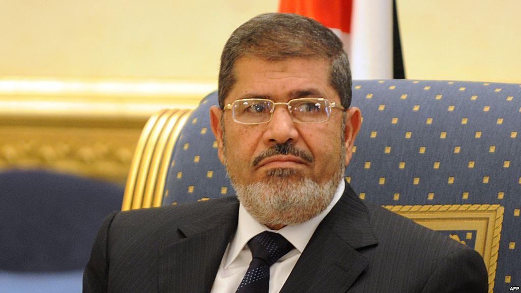 مرسي والبرادعي وبينهما أوباما