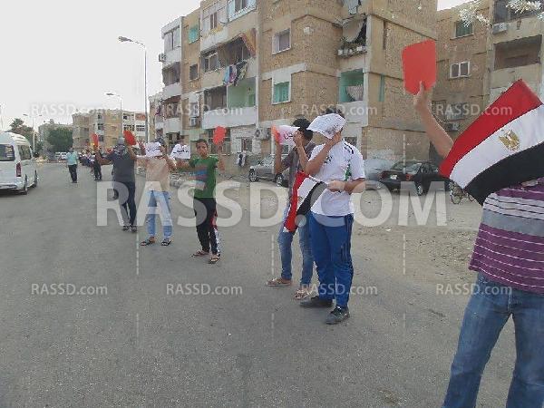 سلاسل بشرية بـ”السويس” للتنديد بالانقلاب العسكري