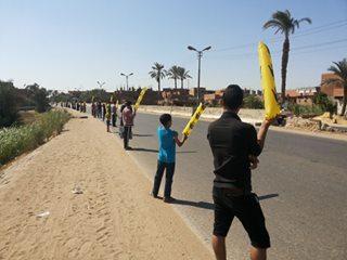 صور | فعالية صباحية بـ”الأعلام” بالفيوم رفضًا لحكم العسكر