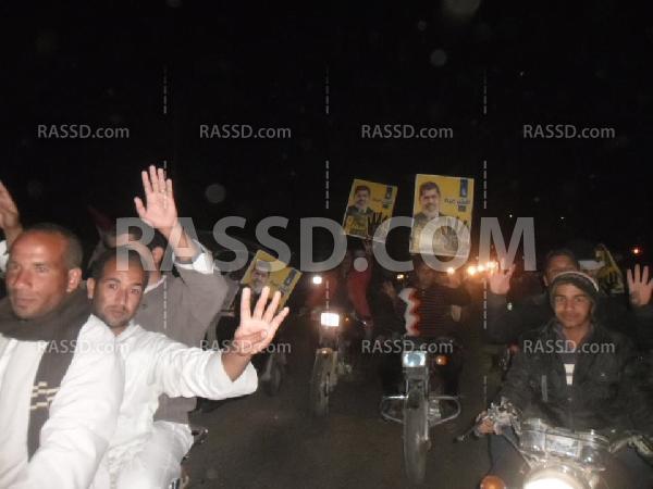 مسيرة بالدرجات النارية بقرى المناشى بسنورس رفضا للانقلاب